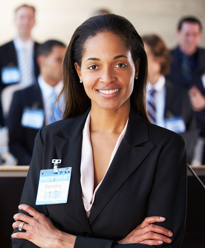 Business woman with arms cross smiling